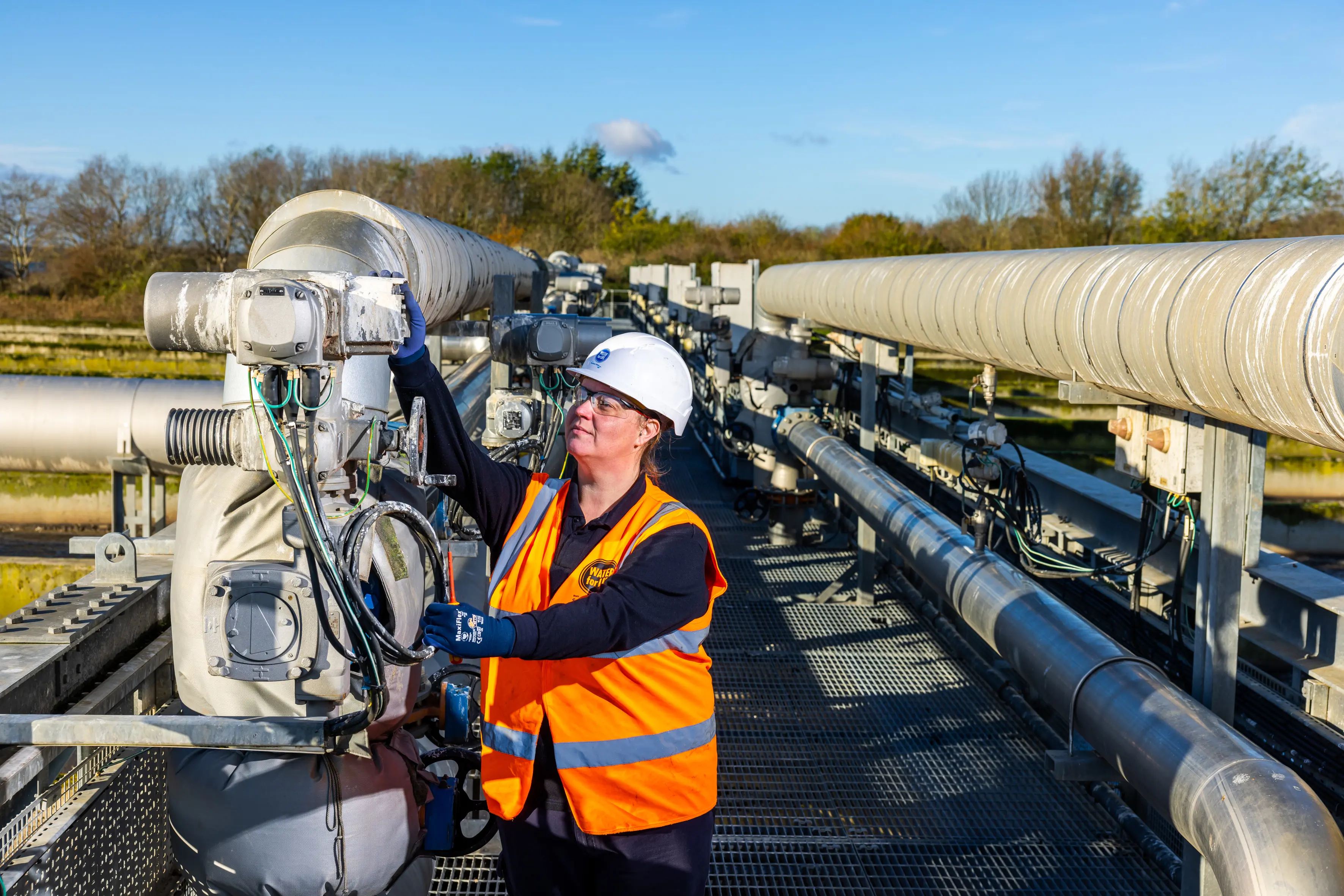 Lady working with machinery at a wastewater treatment site